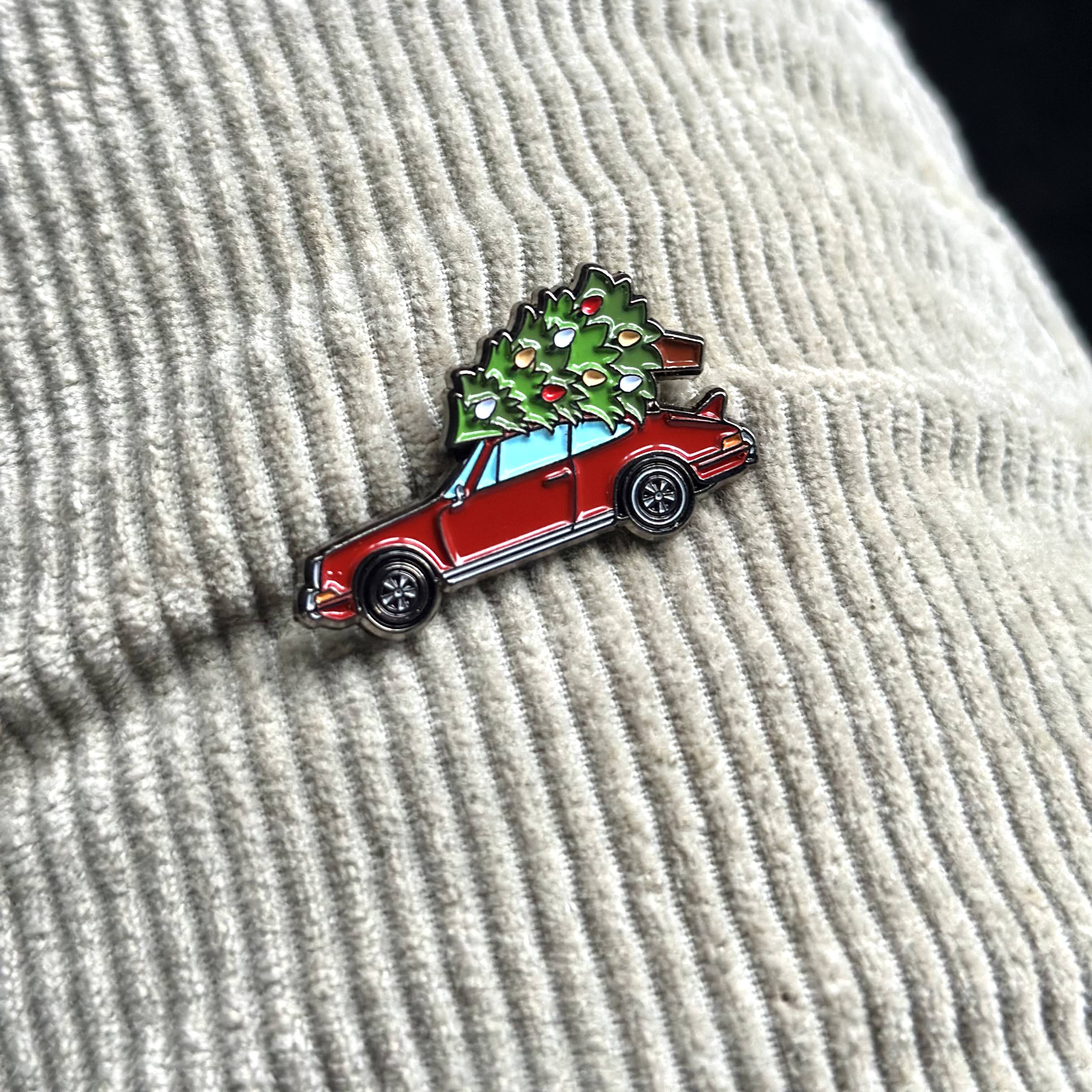 porsche with christmas tree pin