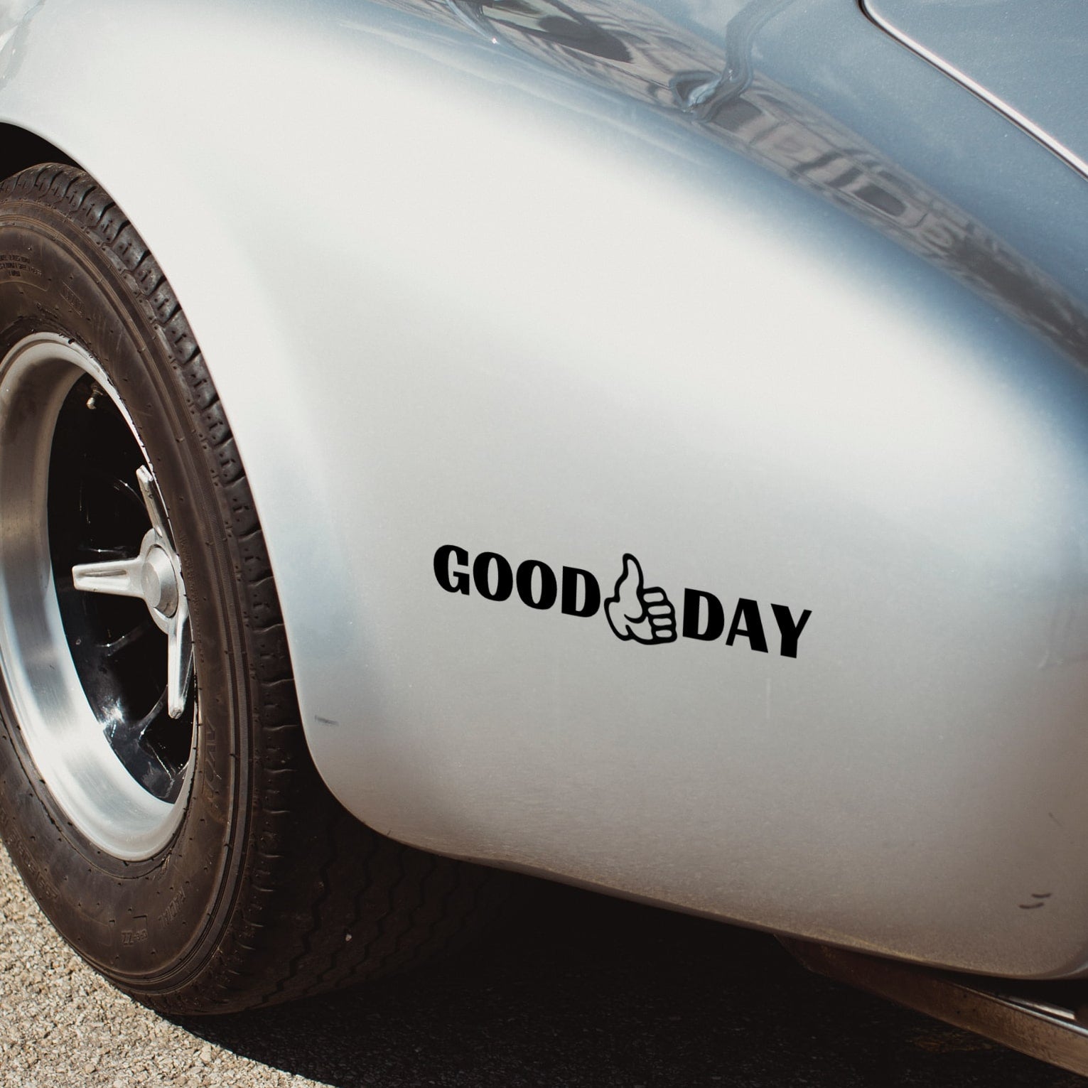 good day sticker on silver cobra car