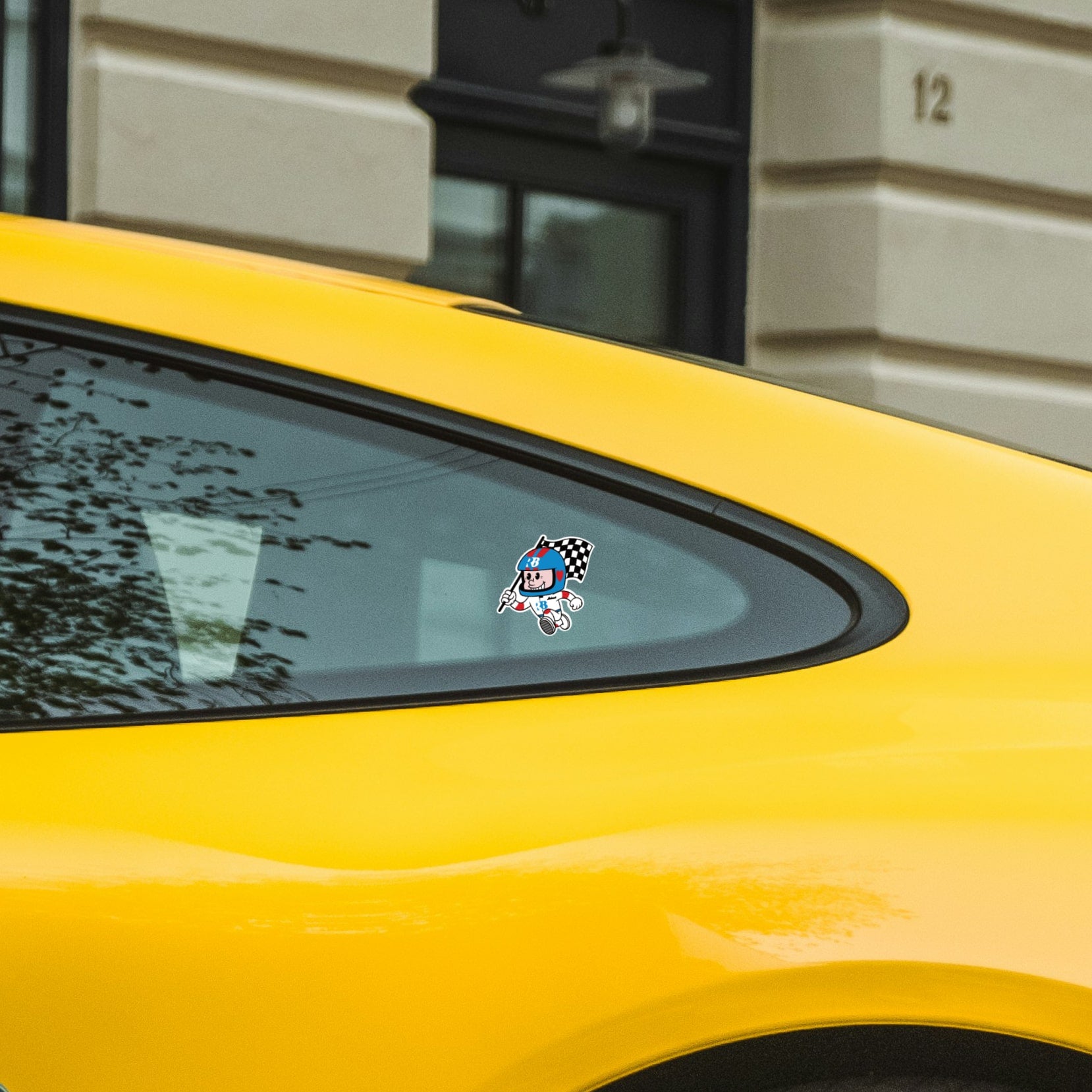 rennbetrieb mascot helmut sticker on yellow porsche 911